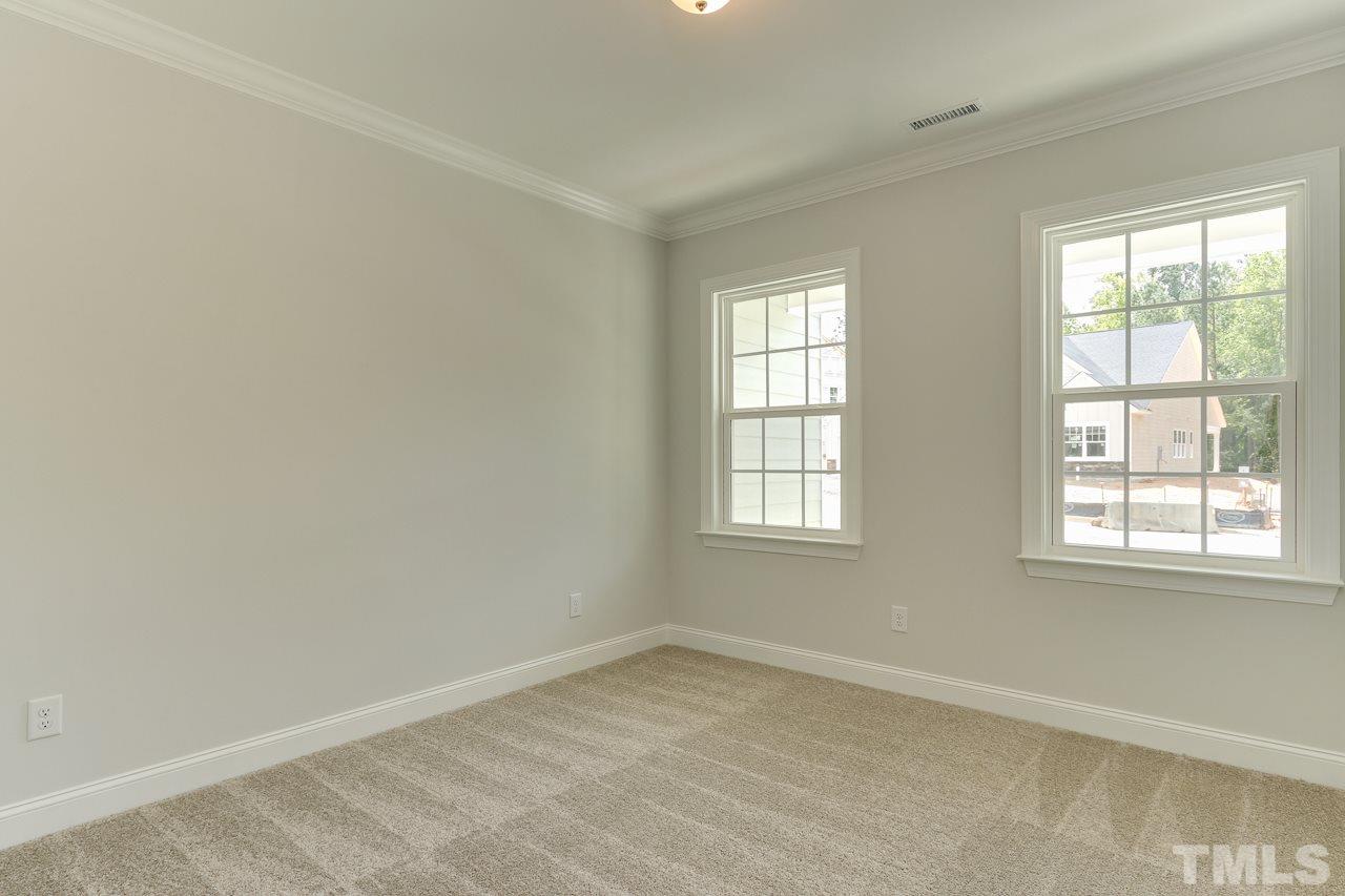 244 Ivory Lane, Unit 72 Raleigh, NC 27610 - Photo 22 of 30 an empty room with a window