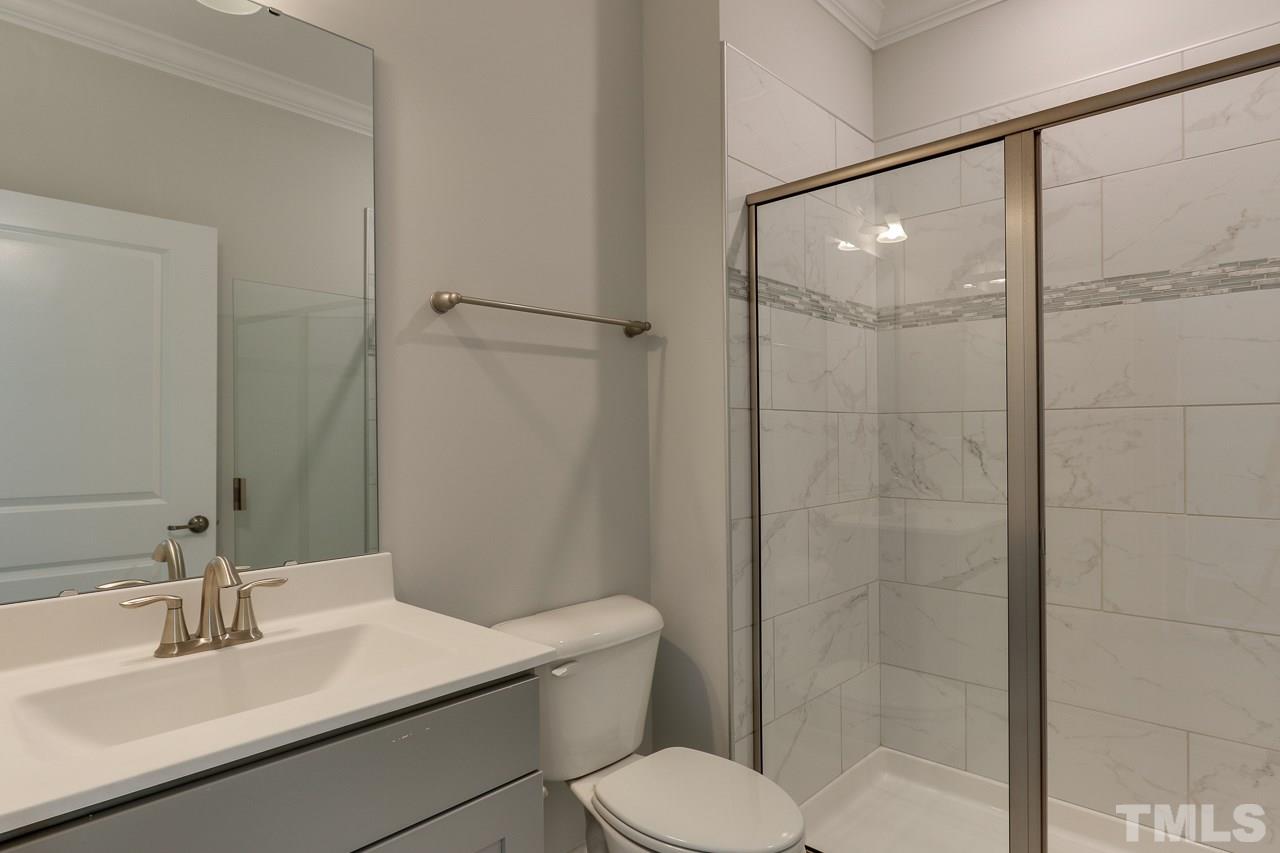 244 Ivory Lane, Unit 72 Raleigh, NC 27610 - Photo 24 of 30 a bathroom with a sink toilet and shower
