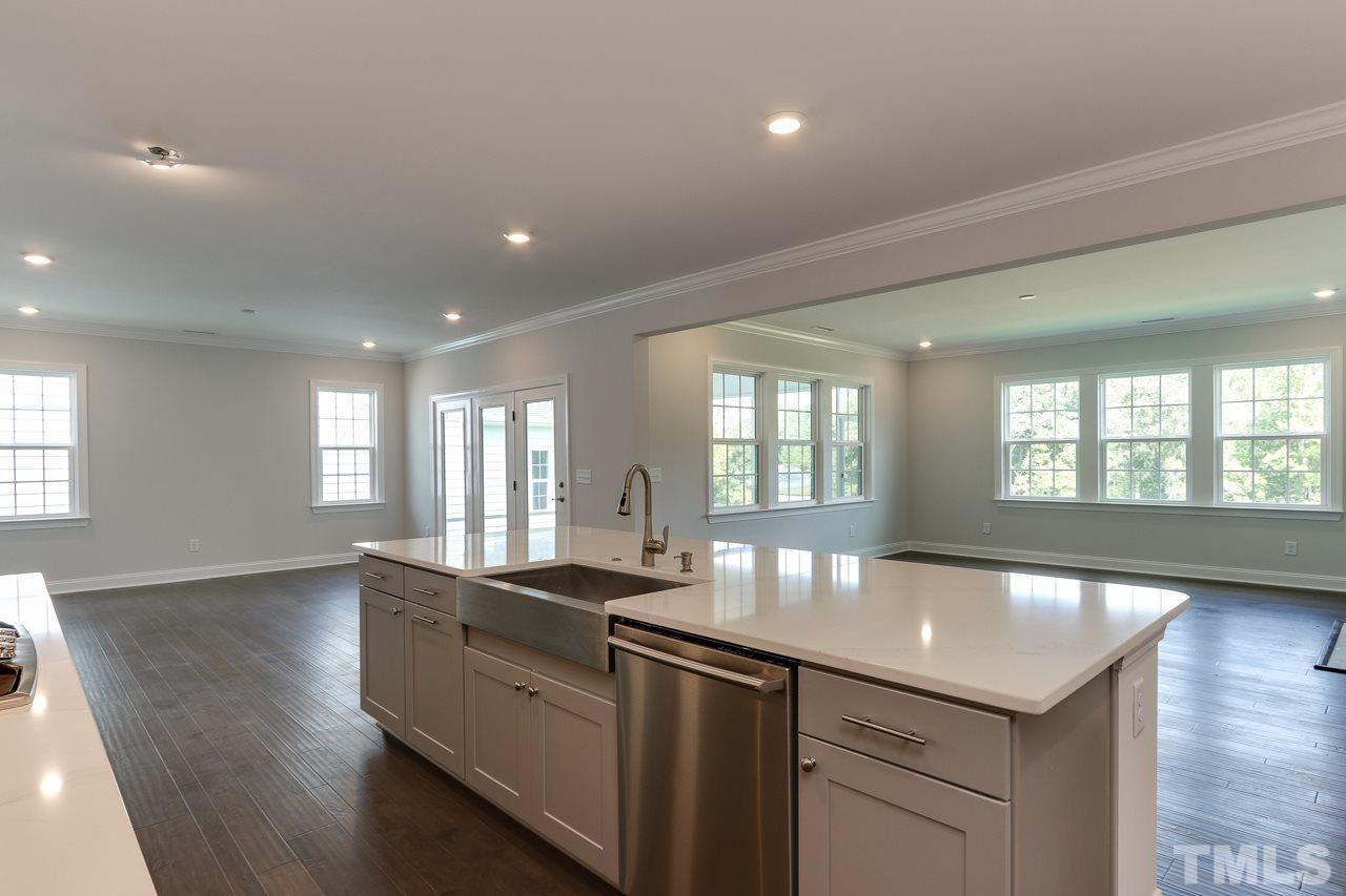244 Ivory Lane, Unit 72 Raleigh, NC 27610 - Photo 7 of 30 a large kitchen with lots of counter space and window