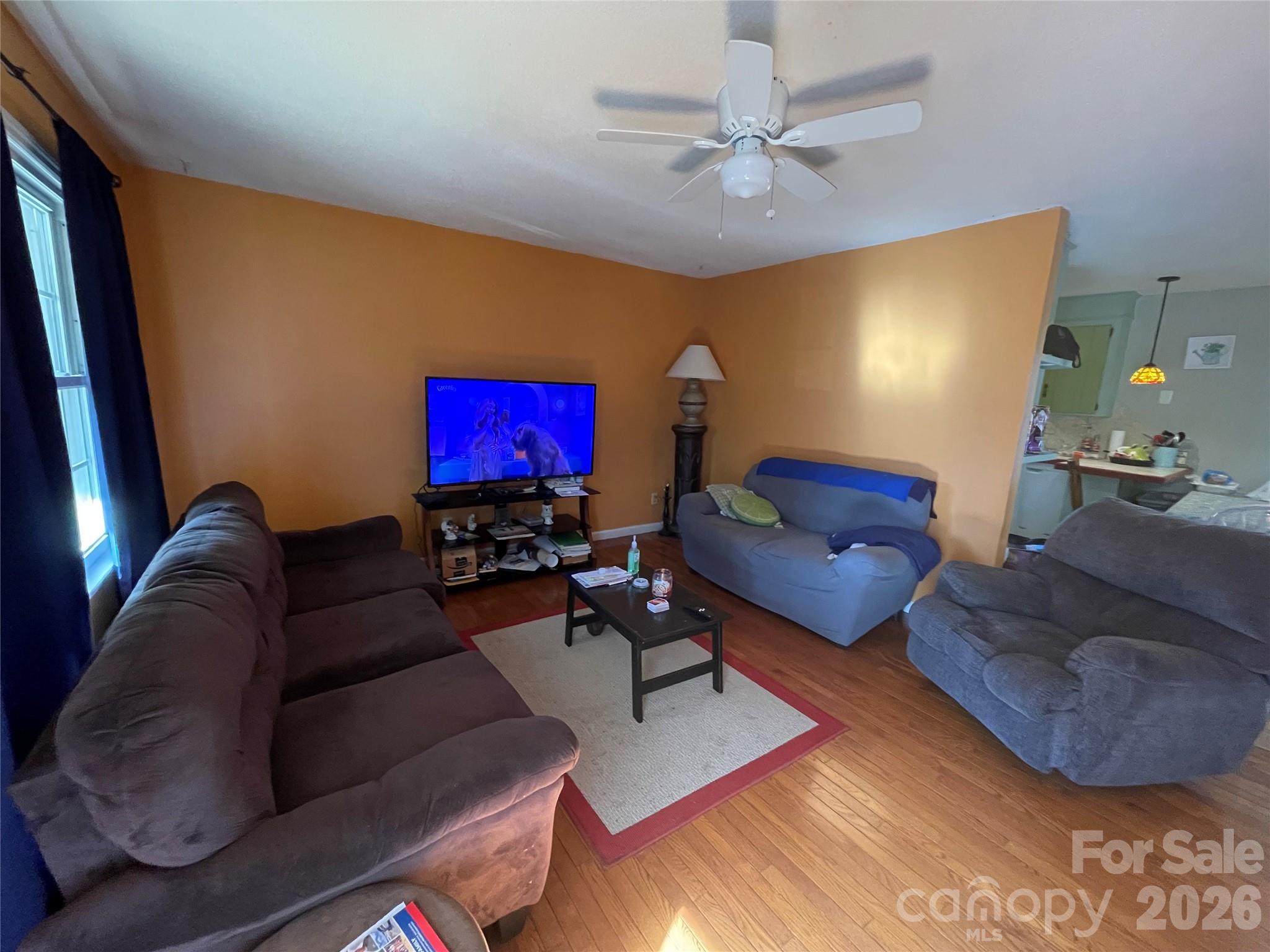 4907 Delmar Griffin Road Monroe, NC 28112 - Photo 4 of 25 a living room with furniture and a flat screen tv
