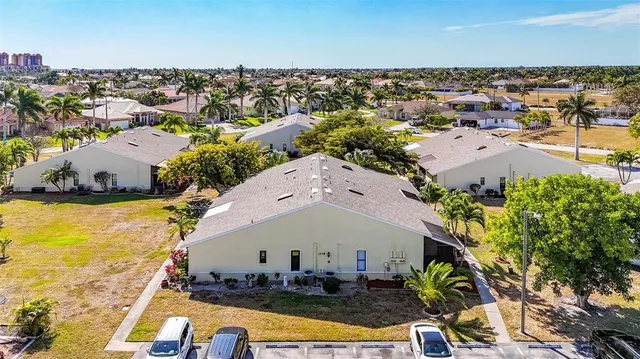 an aerial view of a house with a swimming pool