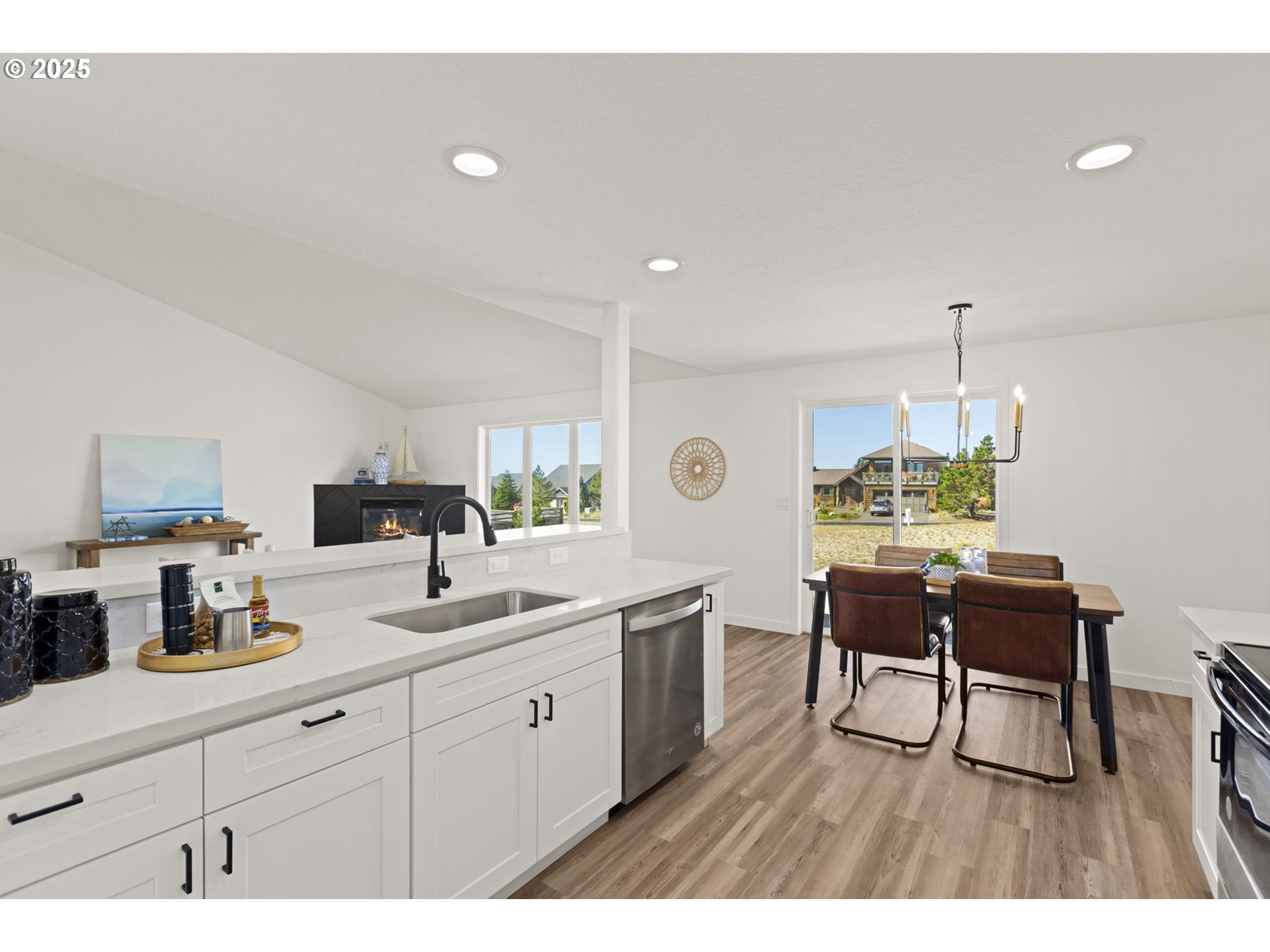 9980 Pine Ridge Drive Nehalem, OR 97131 - Photo 9 of 27 a open kitchen with sink table and chairs