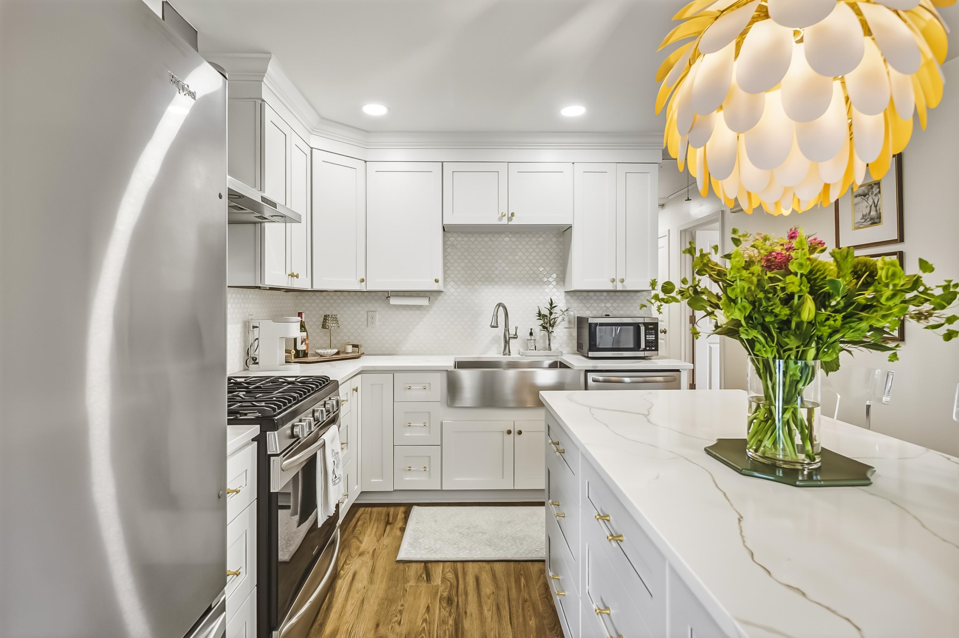 915 Greencliff Road Collierville, TN 38017 - Photo 11 of 32 a kitchen with a white stove top oven and white cabinets