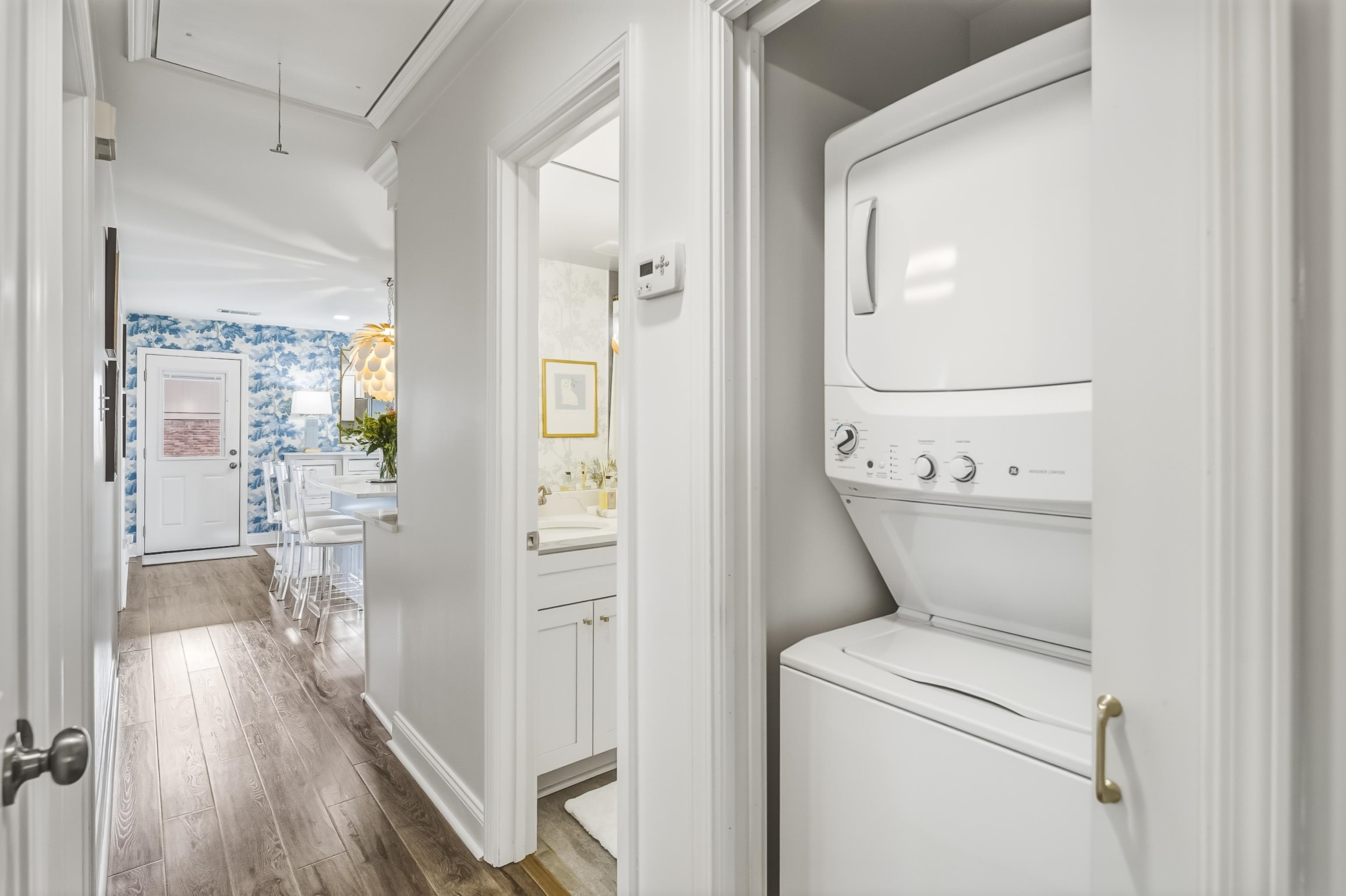 915 Greencliff Road Collierville, TN 38017 - Photo 24 of 32 a view of washer and dryer with wooden floor