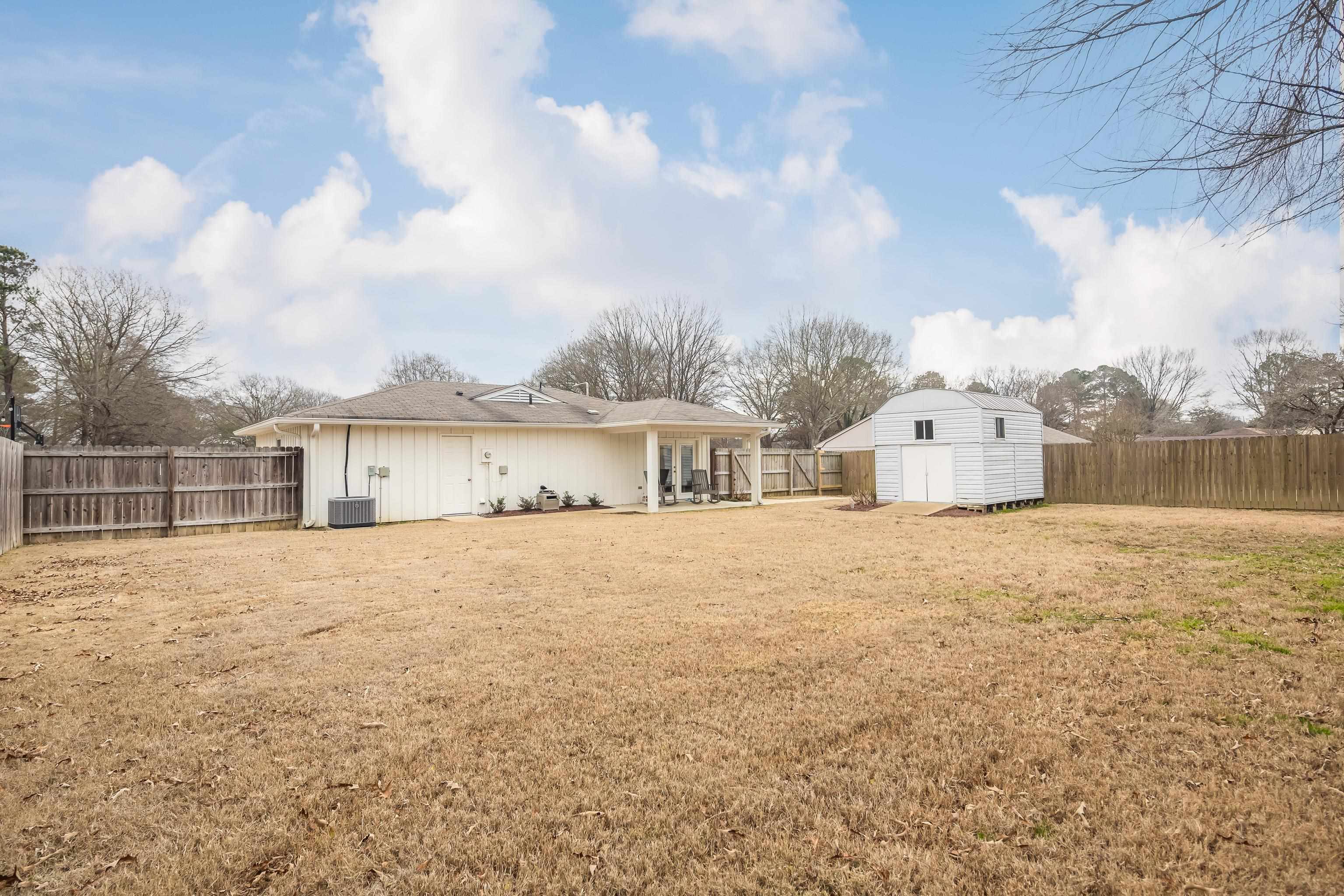 915 Greencliff Road Collierville, TN 38017 - Photo 30 of 32 a view of a house with a yard