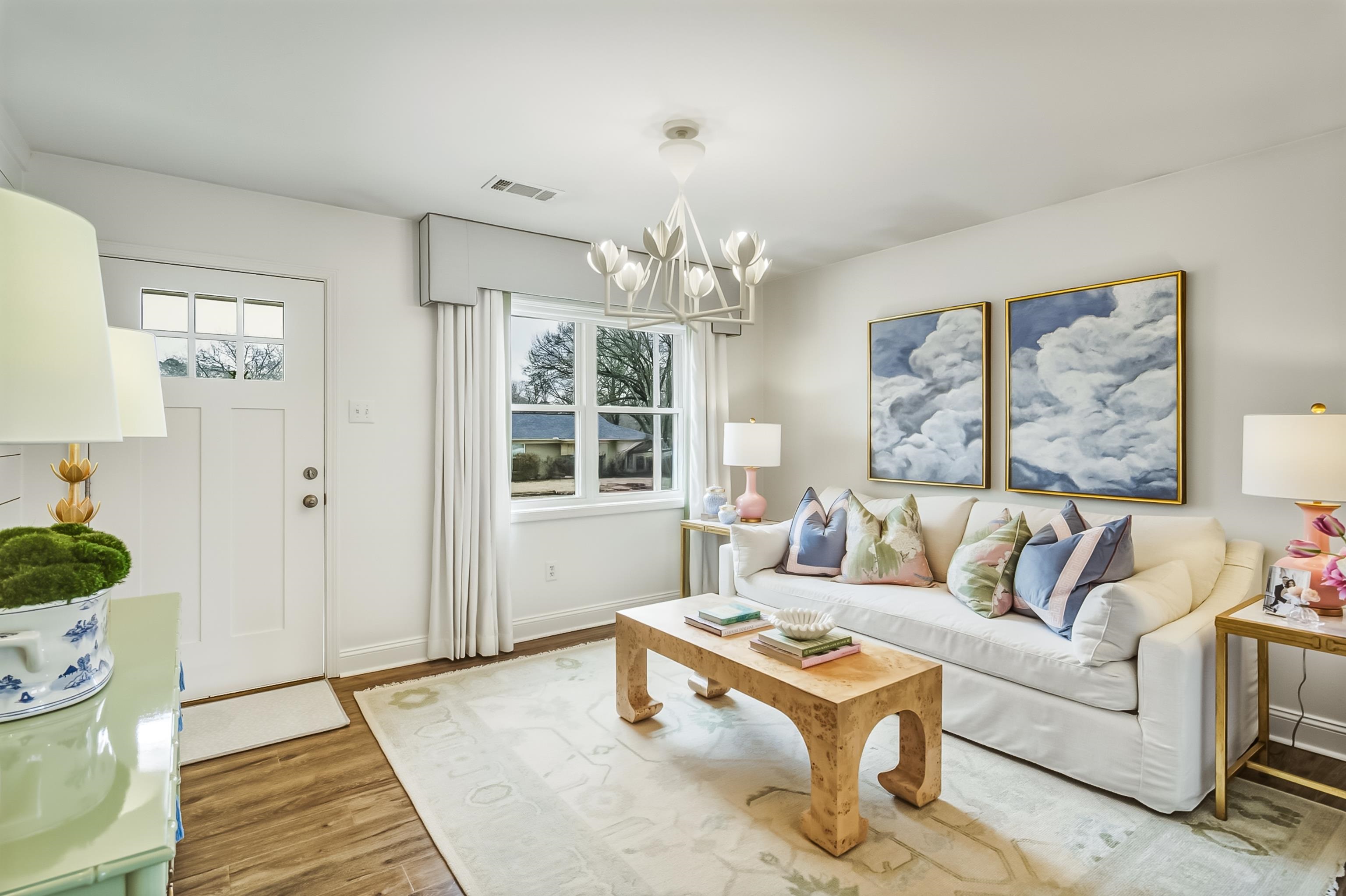 915 Greencliff Road Collierville, TN 38017 - Photo 5 of 32 a living room with furniture and a chandelier