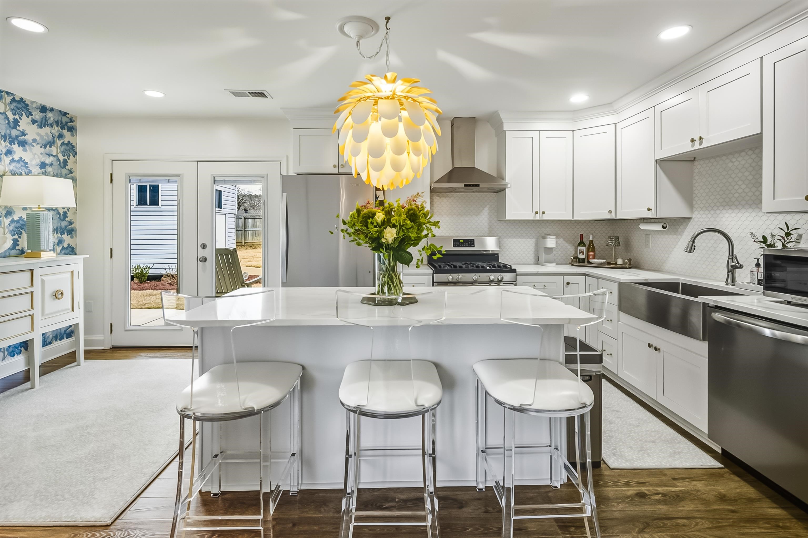 915 Greencliff Road Collierville, TN 38017 - Photo 9 of 32 a kitchen with stainless steel appliances granite countertop a sink and a stove