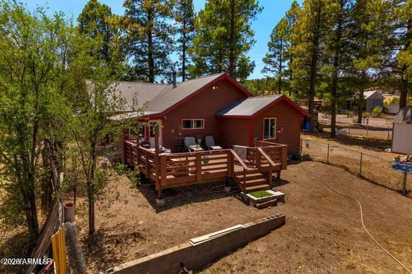 a view of a house with a yard porch and sitting area