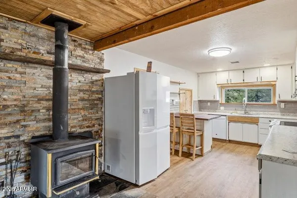 a kitchen with cabinets and stainless steel appliances