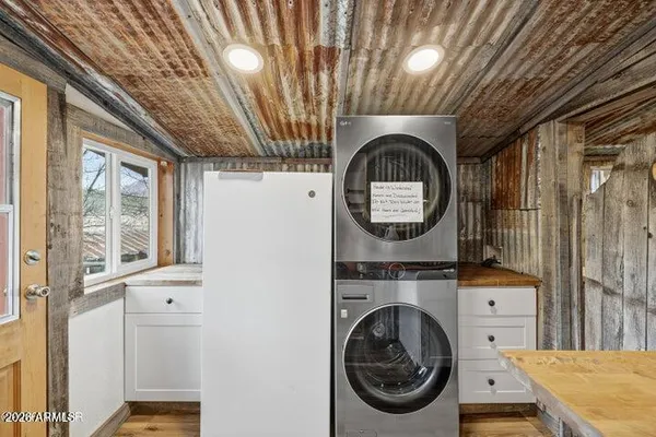 a view of a storage & utility room with a window