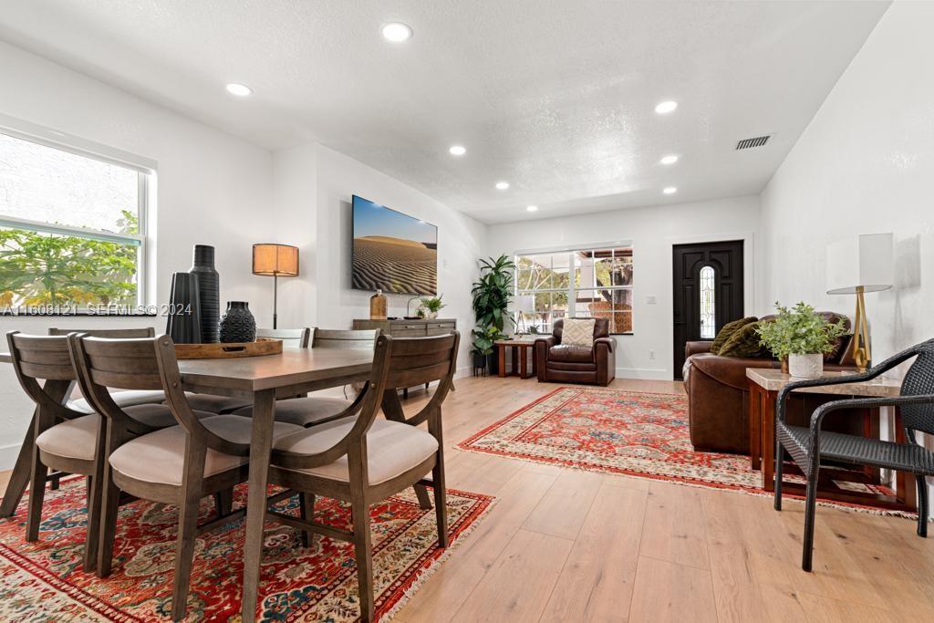 3902 Northwest 3rd Avenue Miami, FL 33127 - Photo 13 of 13 a living room with furniture and a wooden floor