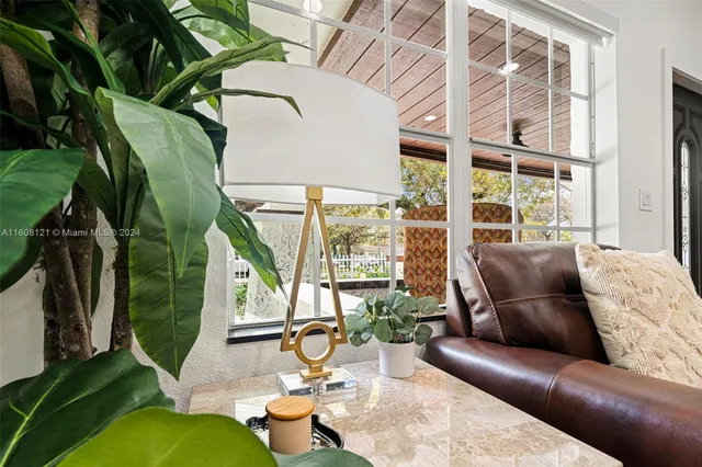 a living room with patio furniture