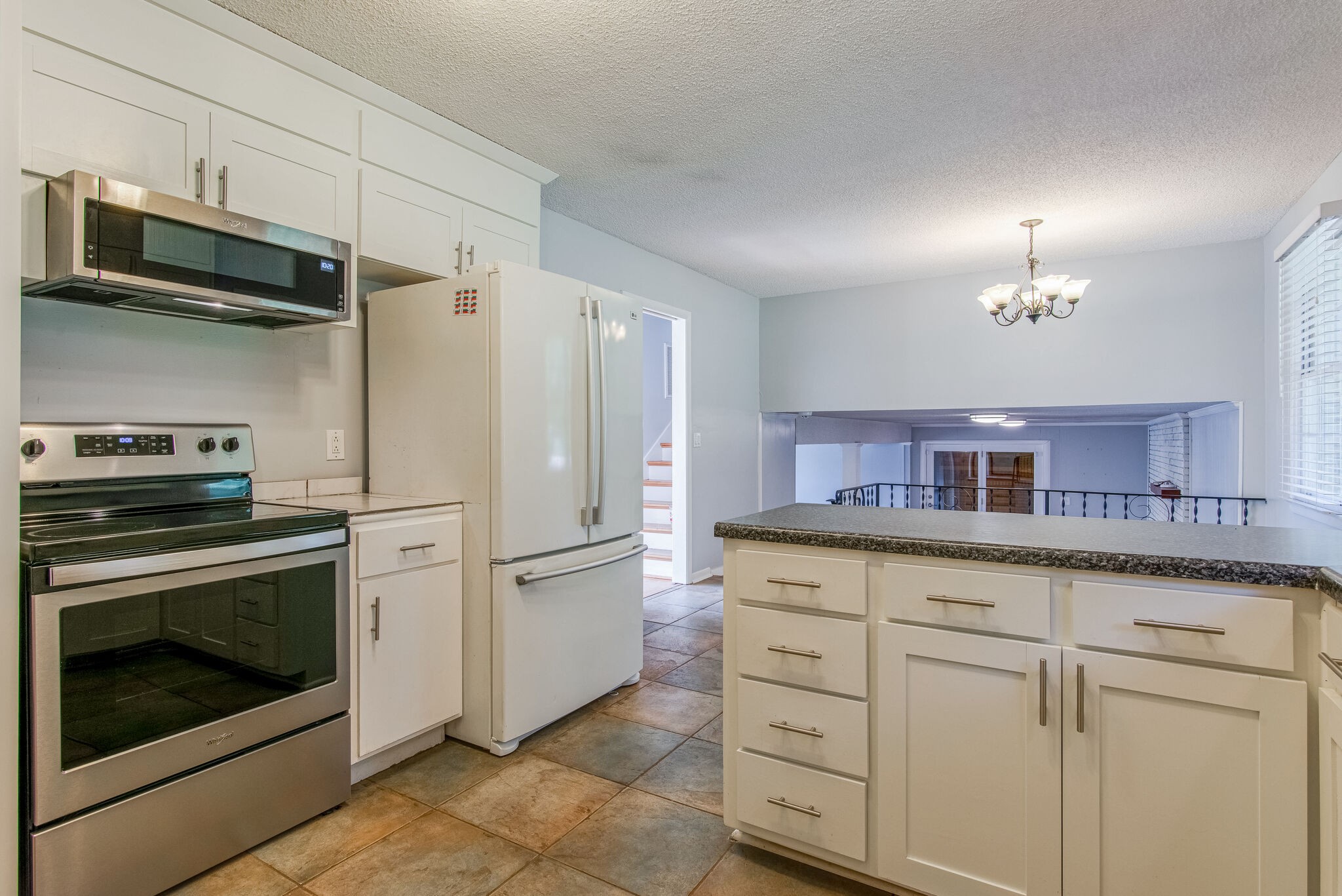 561 Rural Hill Road Nashville, TN 37217 - Photo 11 of 32 a kitchen with white cabinets and stainless steel appliances