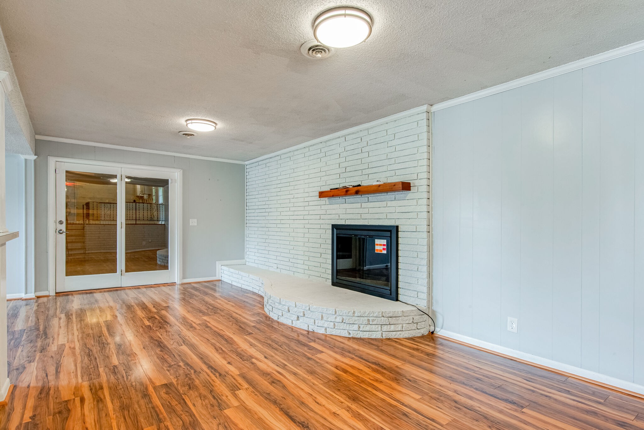 561 Rural Hill Road Nashville, TN 37217 - Photo 13 of 32 a view of empty room with wooden floor and fireplace