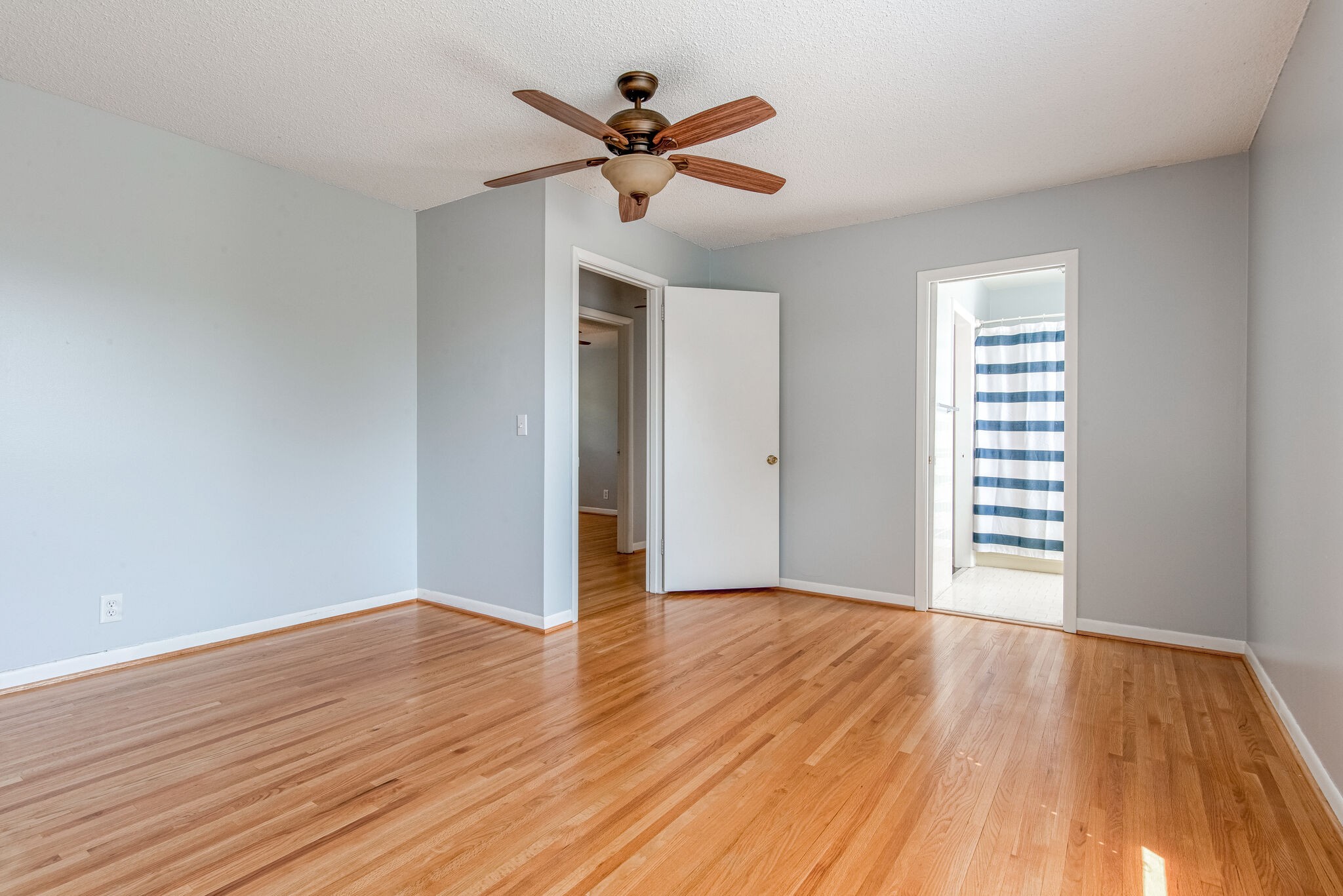 561 Rural Hill Road Nashville, TN 37217 - Photo 22 of 32 a view of an empty room with wooden floor and a ceiling fan