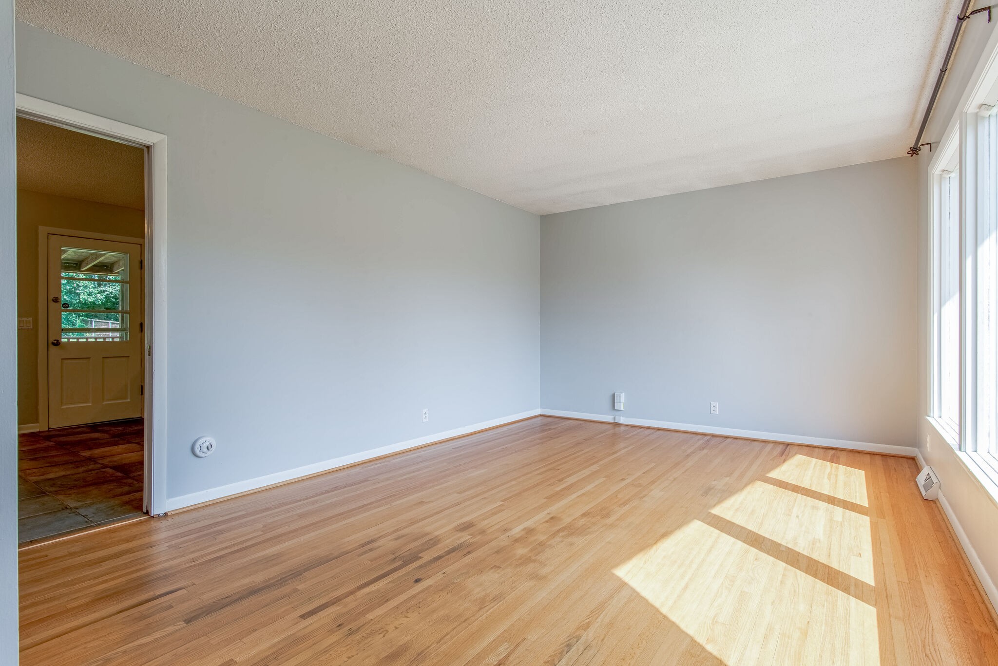 561 Rural Hill Road Nashville, TN 37217 - Photo 6 of 32 an empty room with wooden floor and windows