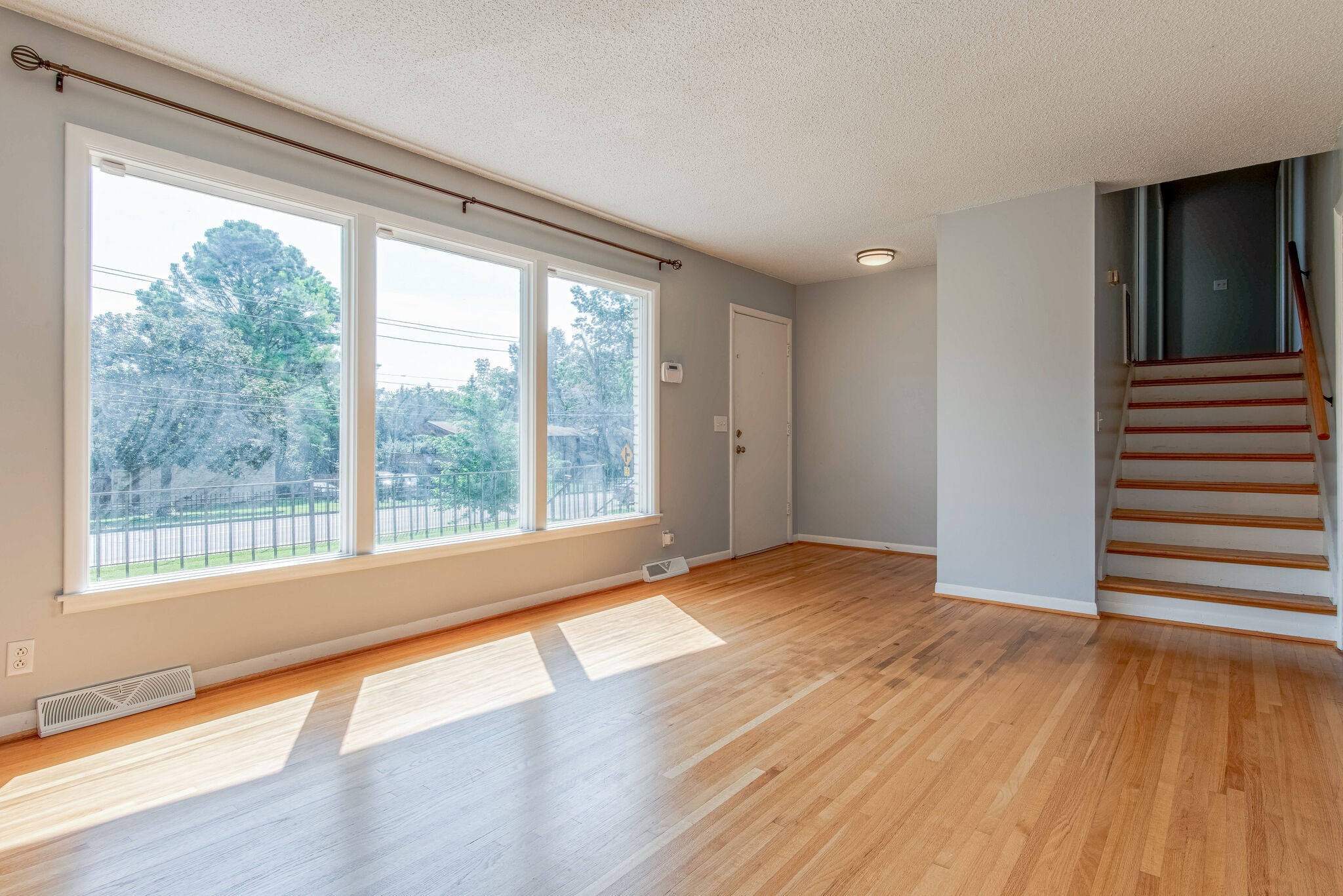 561 Rural Hill Road Nashville, TN 37217 - Photo 7 of 32 a view of an empty room with wooden floor and a window