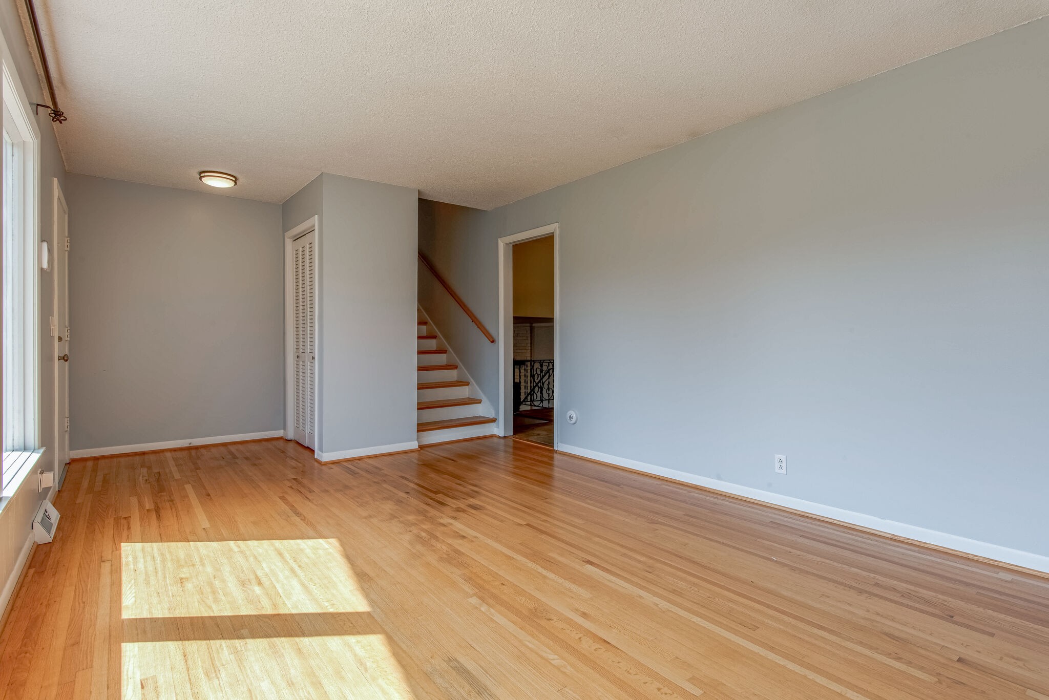 561 Rural Hill Road Nashville, TN 37217 - Photo 8 of 32 a view of an empty room with wooden floor and stairs