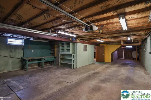 a backyard of a house with wooden floor and fence