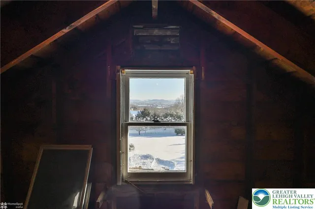 a view of a pathway with a wrought fence