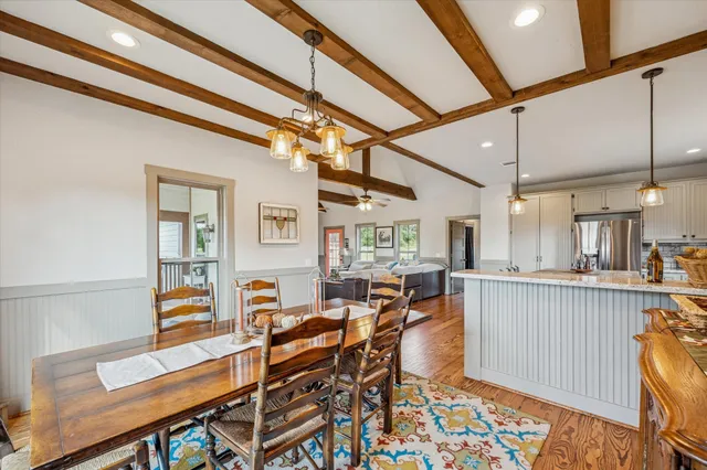 a living room with lots of furniture and a wooden floor