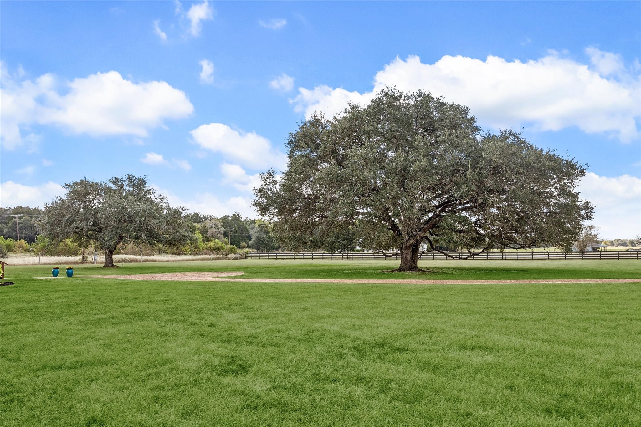 13792 Farm To Market Road 1094 Cat Spring, TX 78933 - Photo 24 of 25 a view of a golf course with a lake