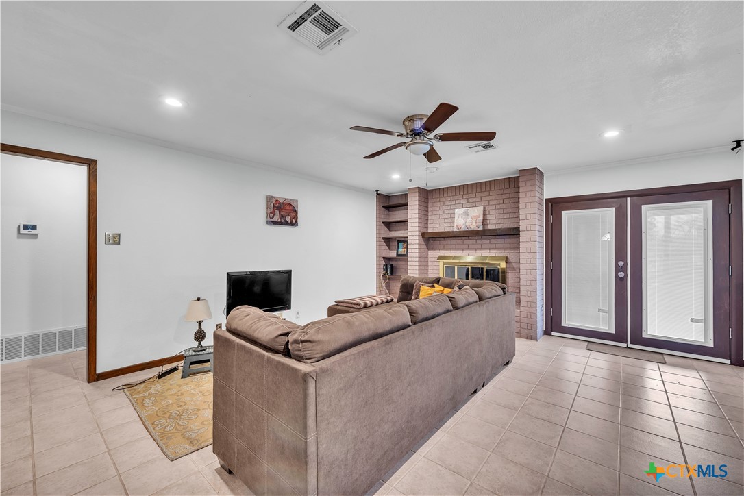 313 Ruggles Loop Temple, TX 76501 - Photo 11 of 22 a living room with furniture and a fireplace