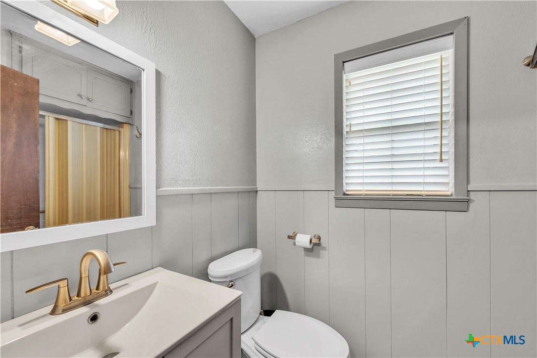 313 Ruggles Loop Temple, TX 76501 - Photo 21 of 22 a bathroom with a toilet a sink and a window
