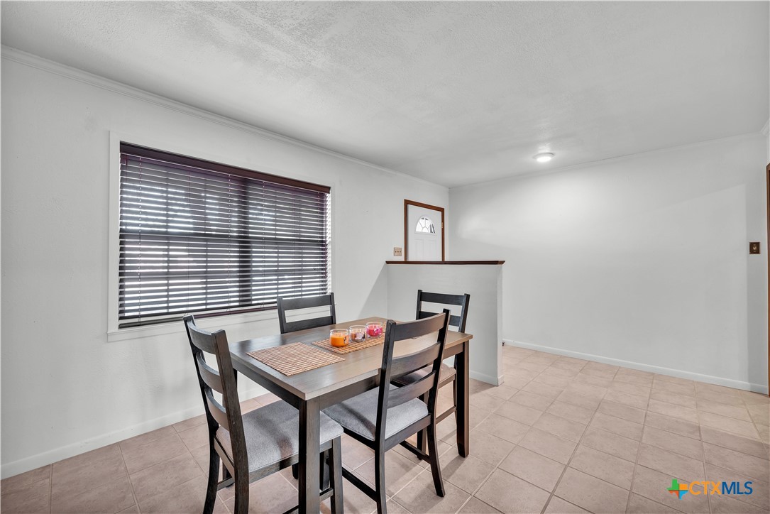 313 Ruggles Loop Temple, TX 76501 - Photo 7 of 22 a view of a dining room with furniture and a window