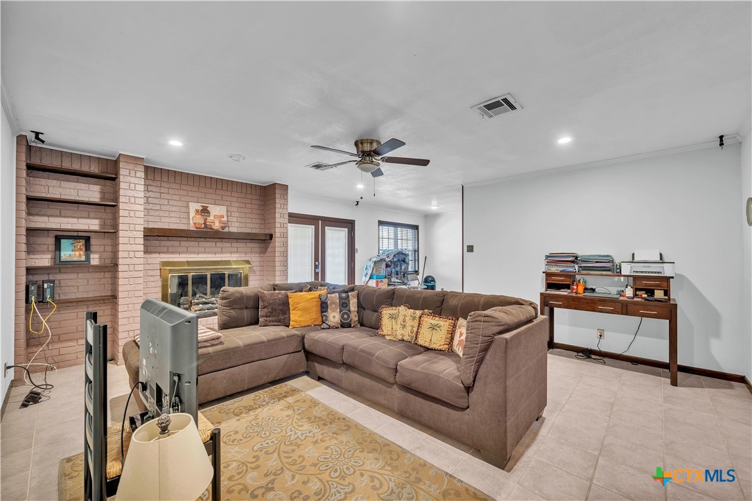 313 Ruggles Loop Temple, TX 76501 - Photo 10 of 22 a living room with furniture fireplace and a large window