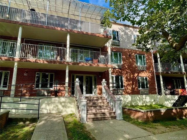 a view of a building with sitting area