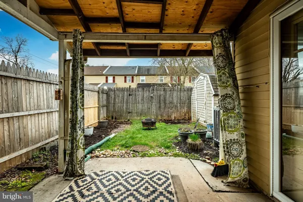 a view of a door with a door and wooden floor