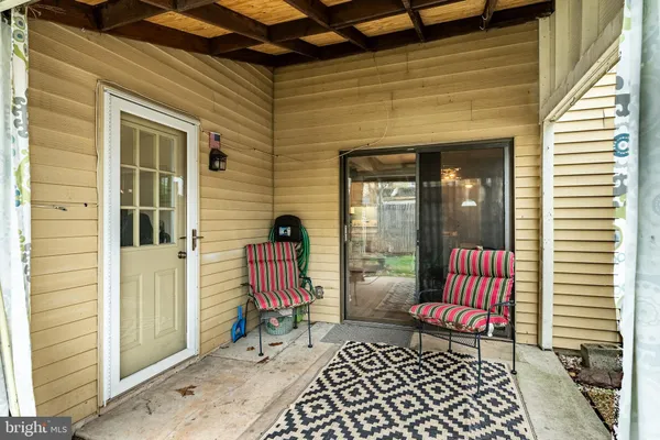 a view of a door and chair in the balcony