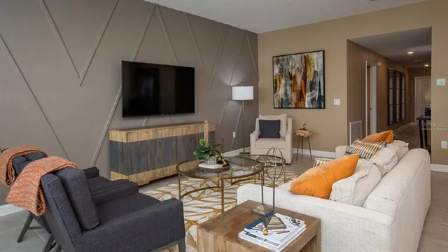 a living room with furniture and a flat screen tv