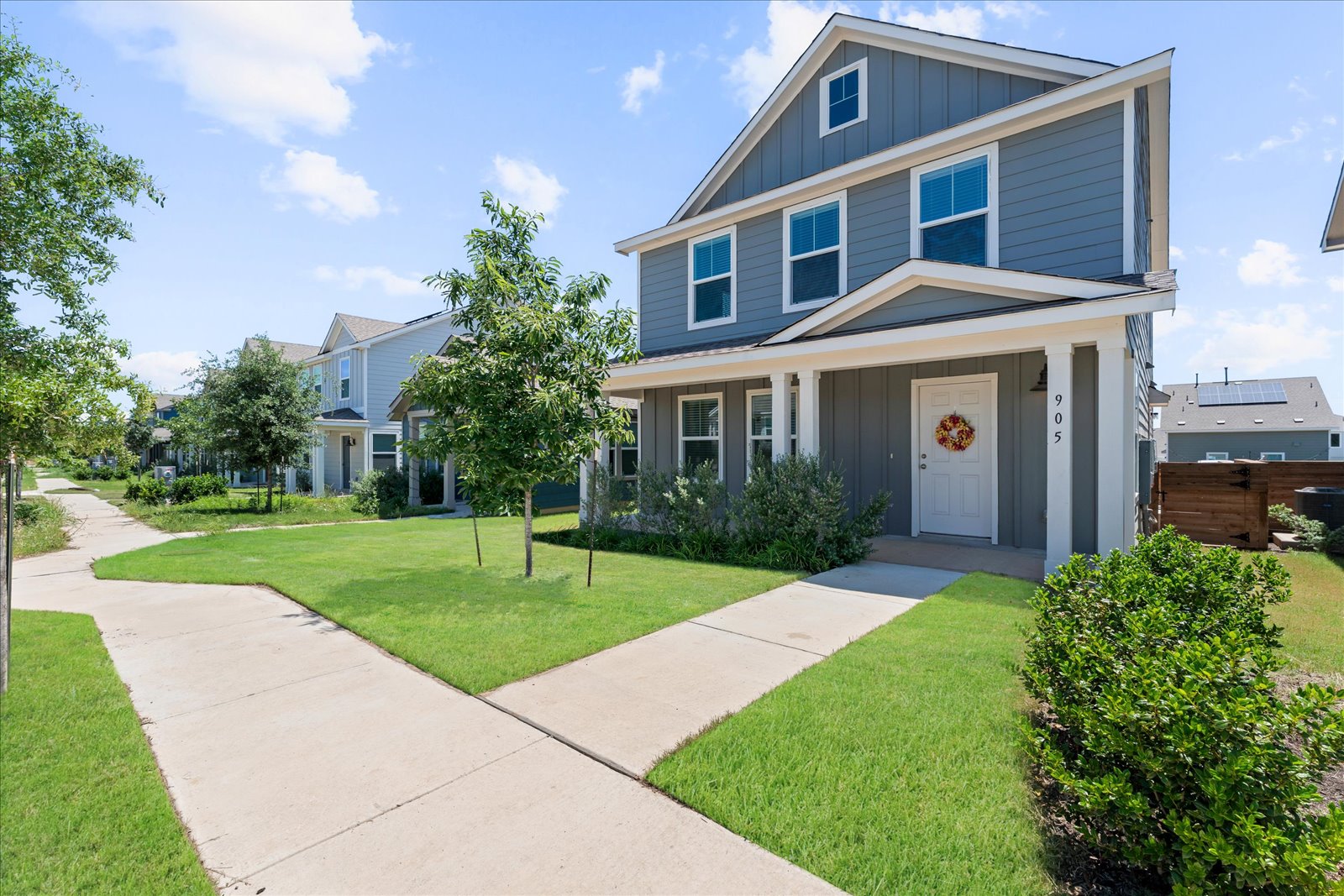 905 Powell Kyle, TX 78640 - Photo 2 of 37 a front view of a house with a yard