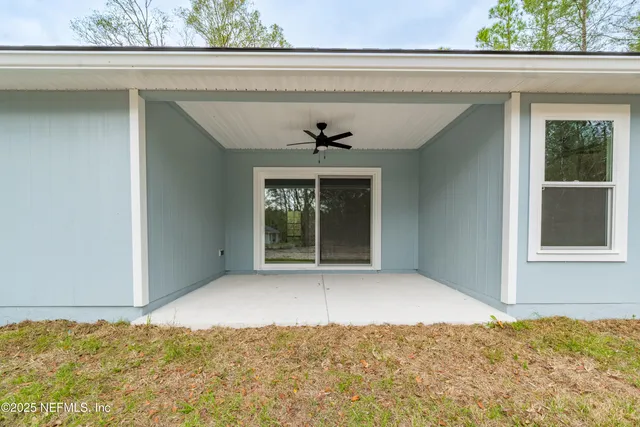 a view of kitchen with furniture and wooden floor