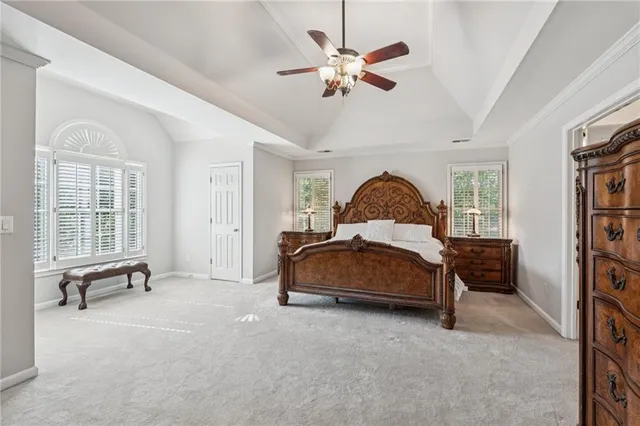 a bed room with a bed and a chair