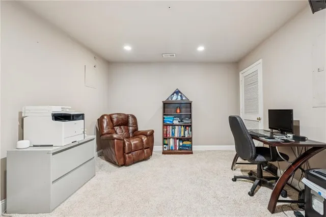 a workspace with furniture and white cabinet