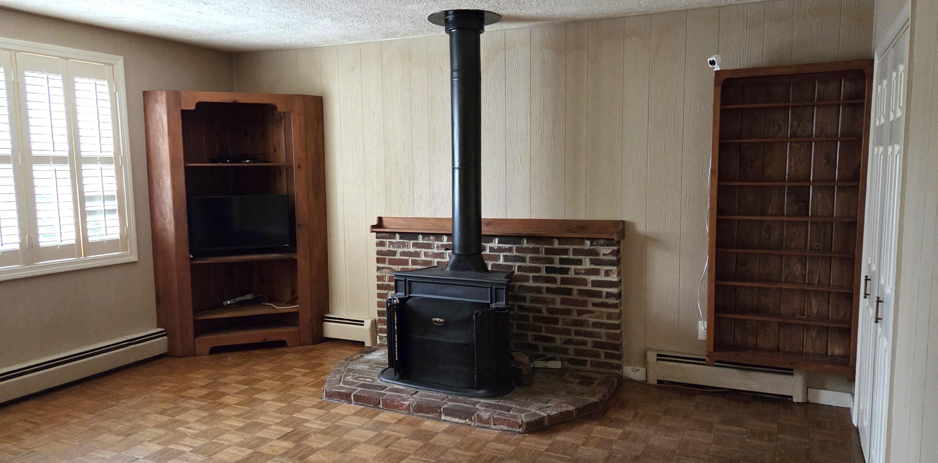 65 Middle Avenue Mexico, ME 04257 - Photo 6 of 37 Living room1 with electric fireplace
