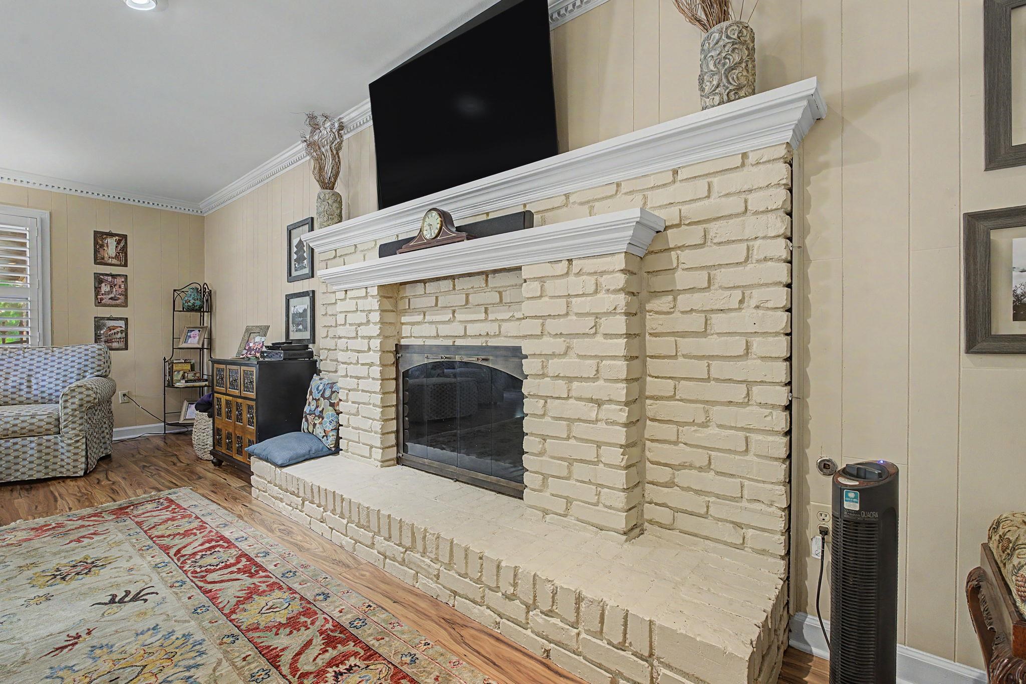 1929 Miller Farms Road Germantown, TN 38138 - Photo 11 of 40 Brick fireplace with a substantial hearth and classic white mantel