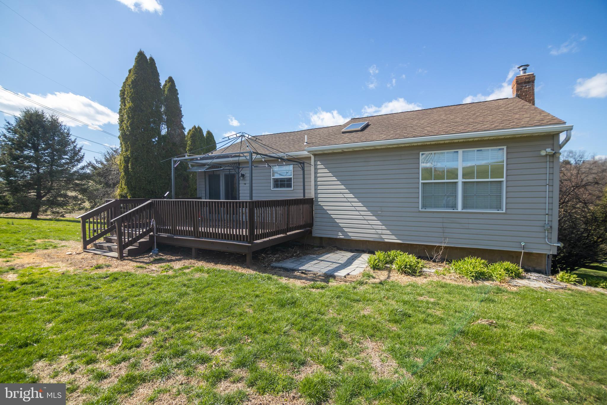 185 Elfner Road Red Lion, PA 17356 - Photo 16 of 34 a backyard of a house with table and chairs