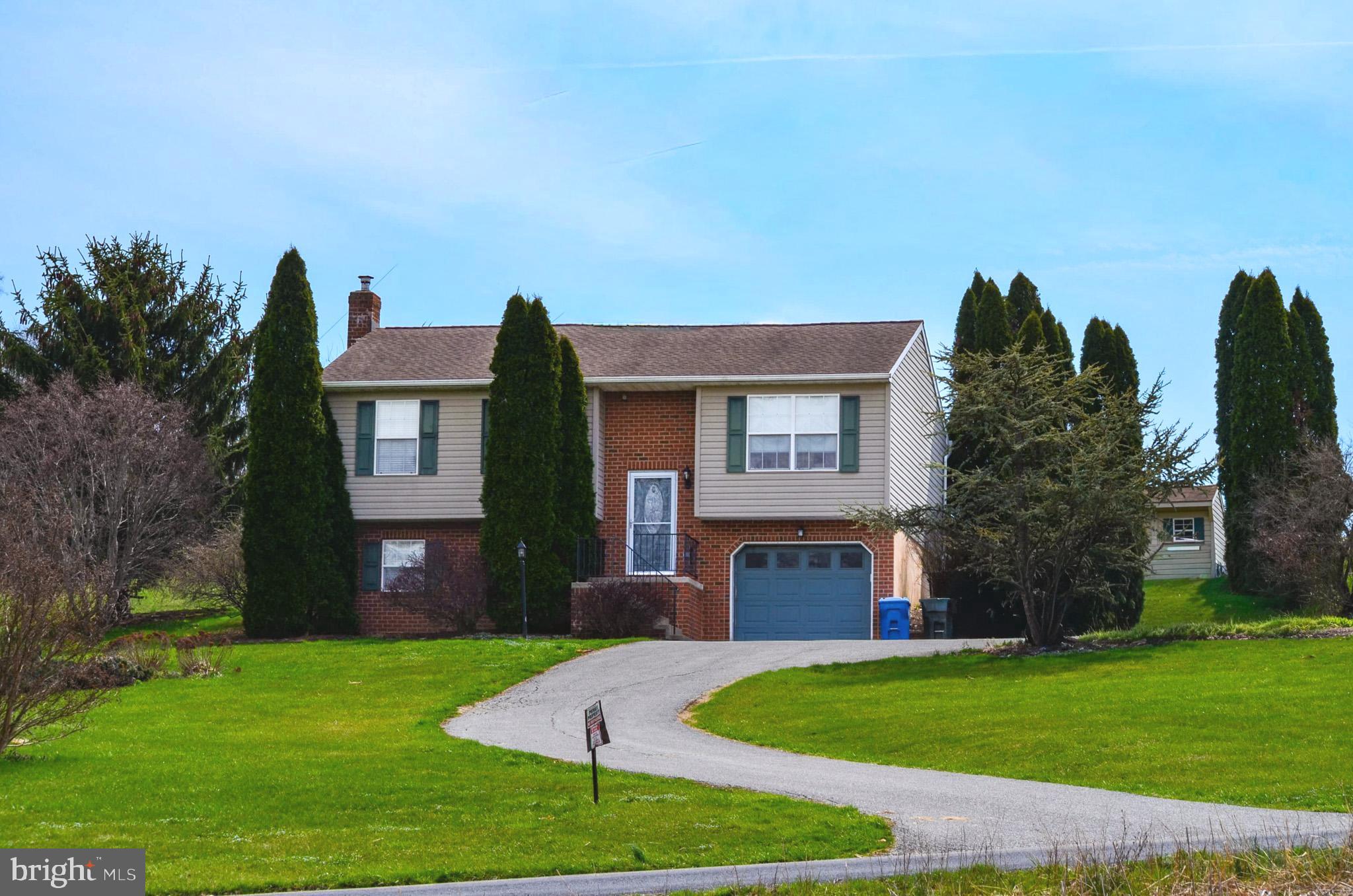 185 Elfner Road Red Lion, PA 17356 - Photo 2 of 34 a front view of a house with a yard and garage
