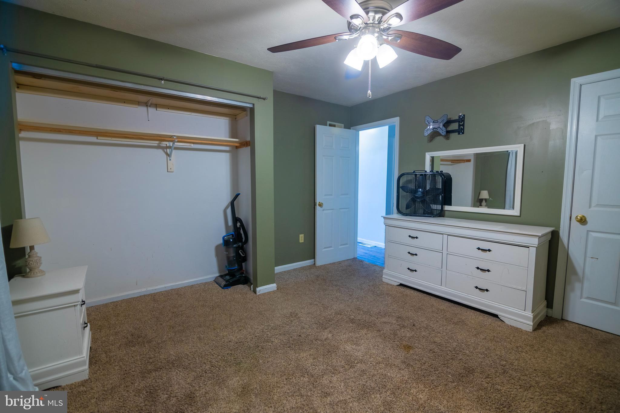 185 Elfner Road Red Lion, PA 17356 - Photo 22 of 34 a bedroom with a bed and a chandelier