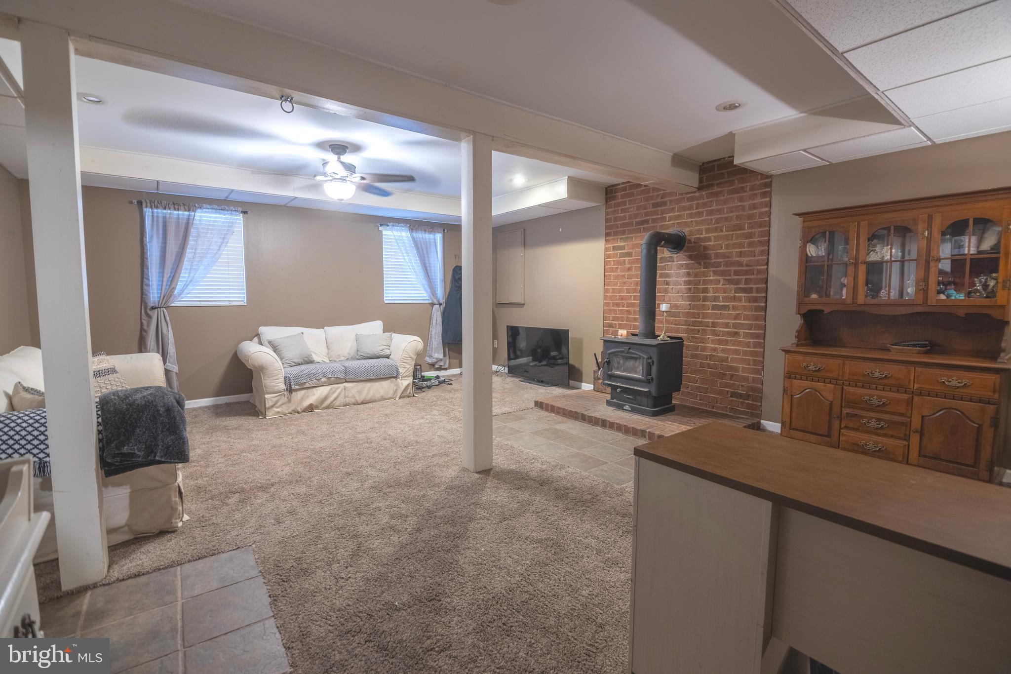 185 Elfner Road Red Lion, PA 17356 - Photo 27 of 34 a living room with furniture and a lamp