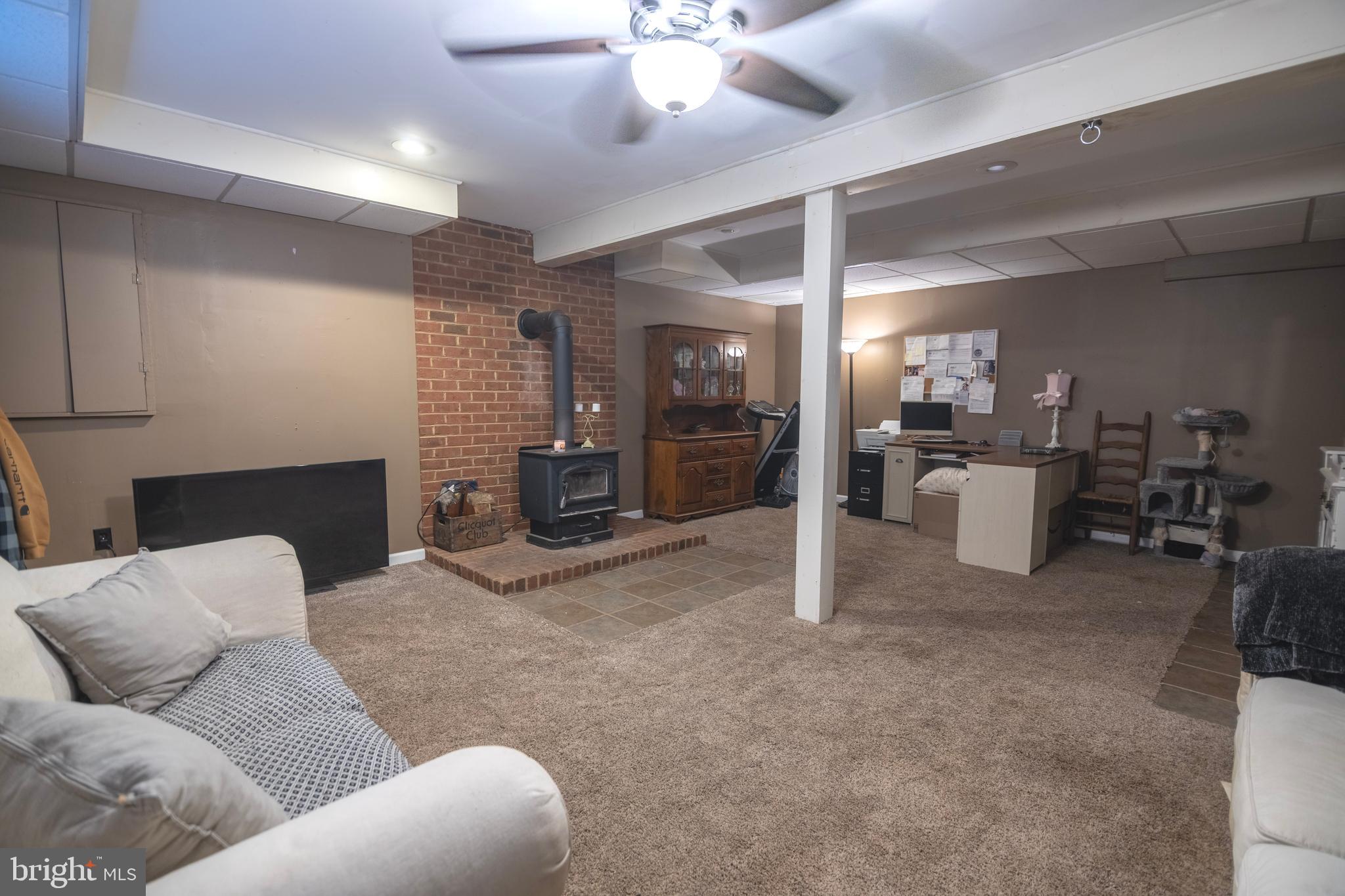 185 Elfner Road Red Lion, PA 17356 - Photo 28 of 34 a living room with furniture and a chandelier