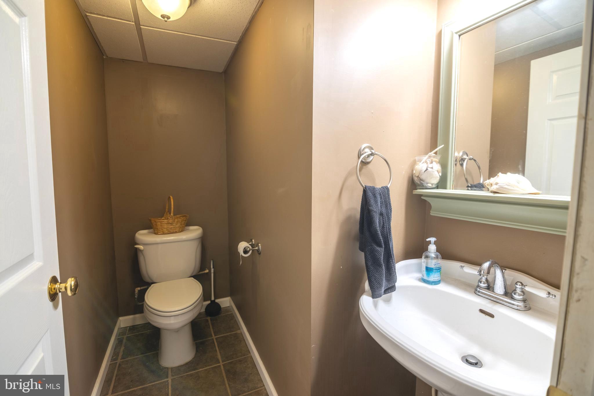 185 Elfner Road Red Lion, PA 17356 - Photo 29 of 34 a bathroom with a sink toilet and mirror