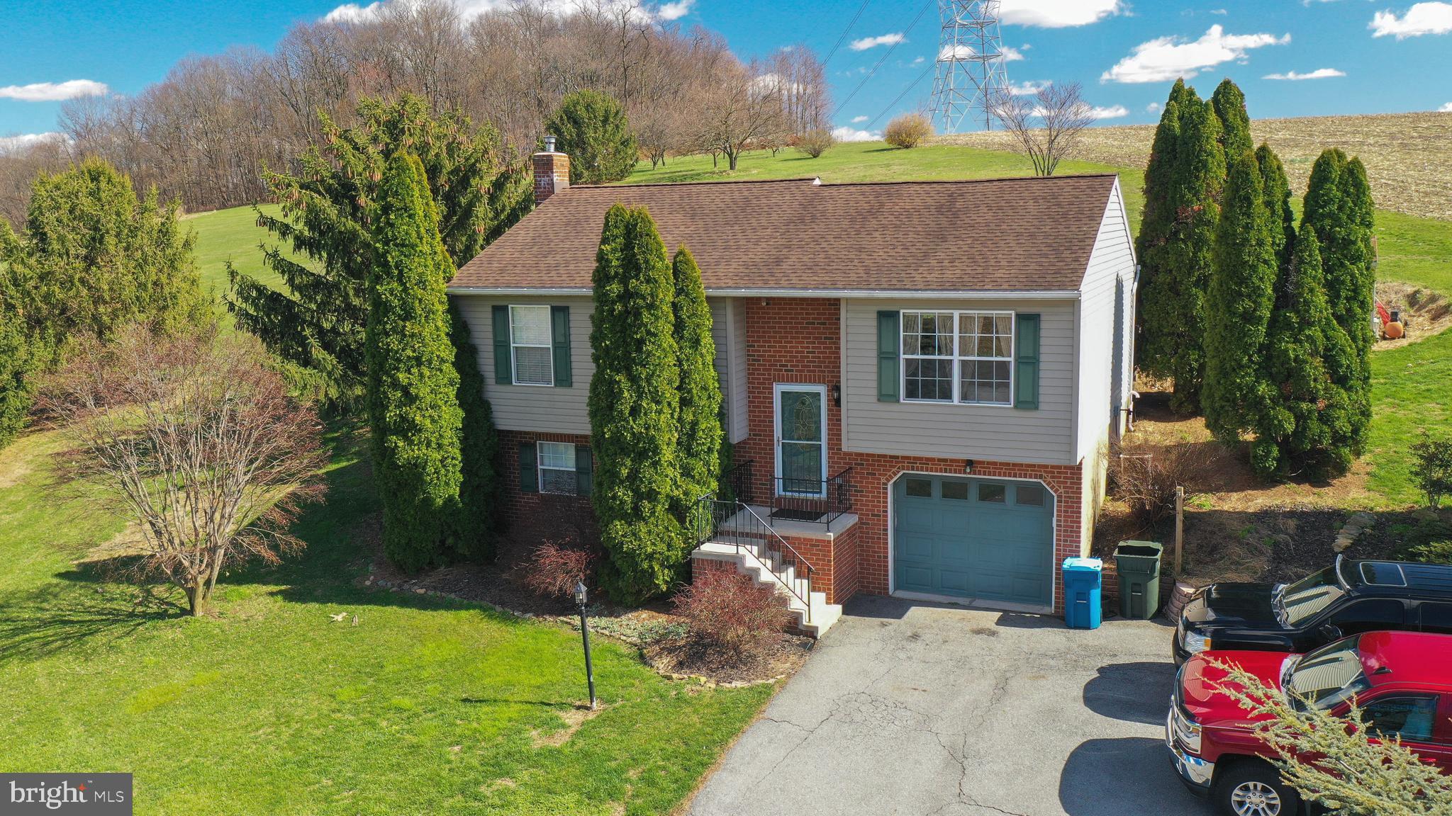 185 Elfner Road Red Lion, PA 17356 - Photo 3 of 34 a front view of a house with garden