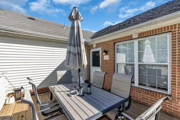 a view of a balcony with wooden floor