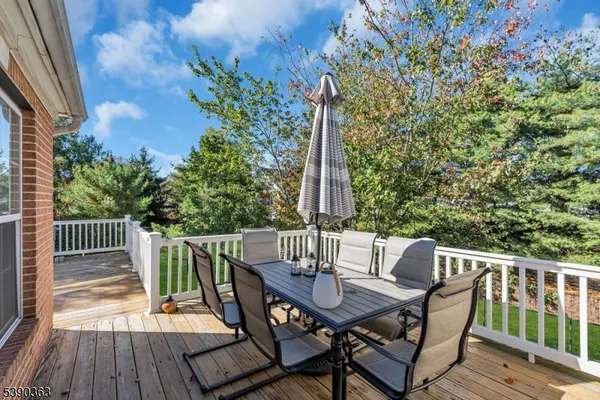 a view of balcony with furniture and wooden deck
