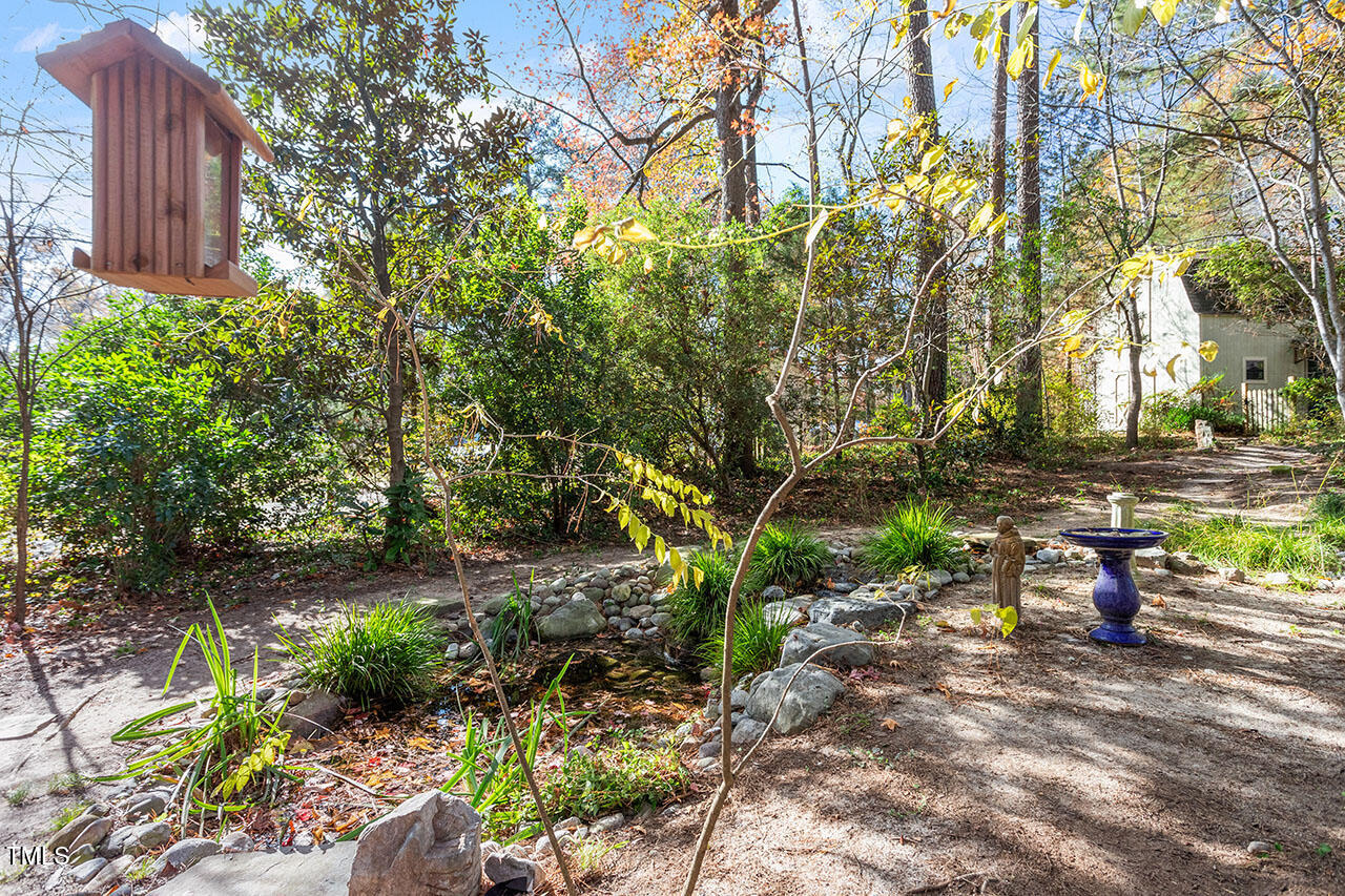 3924 Willow Oak Road Raleigh, NC 27604 - Photo 8 of 10 a view of yard with green space and seating area